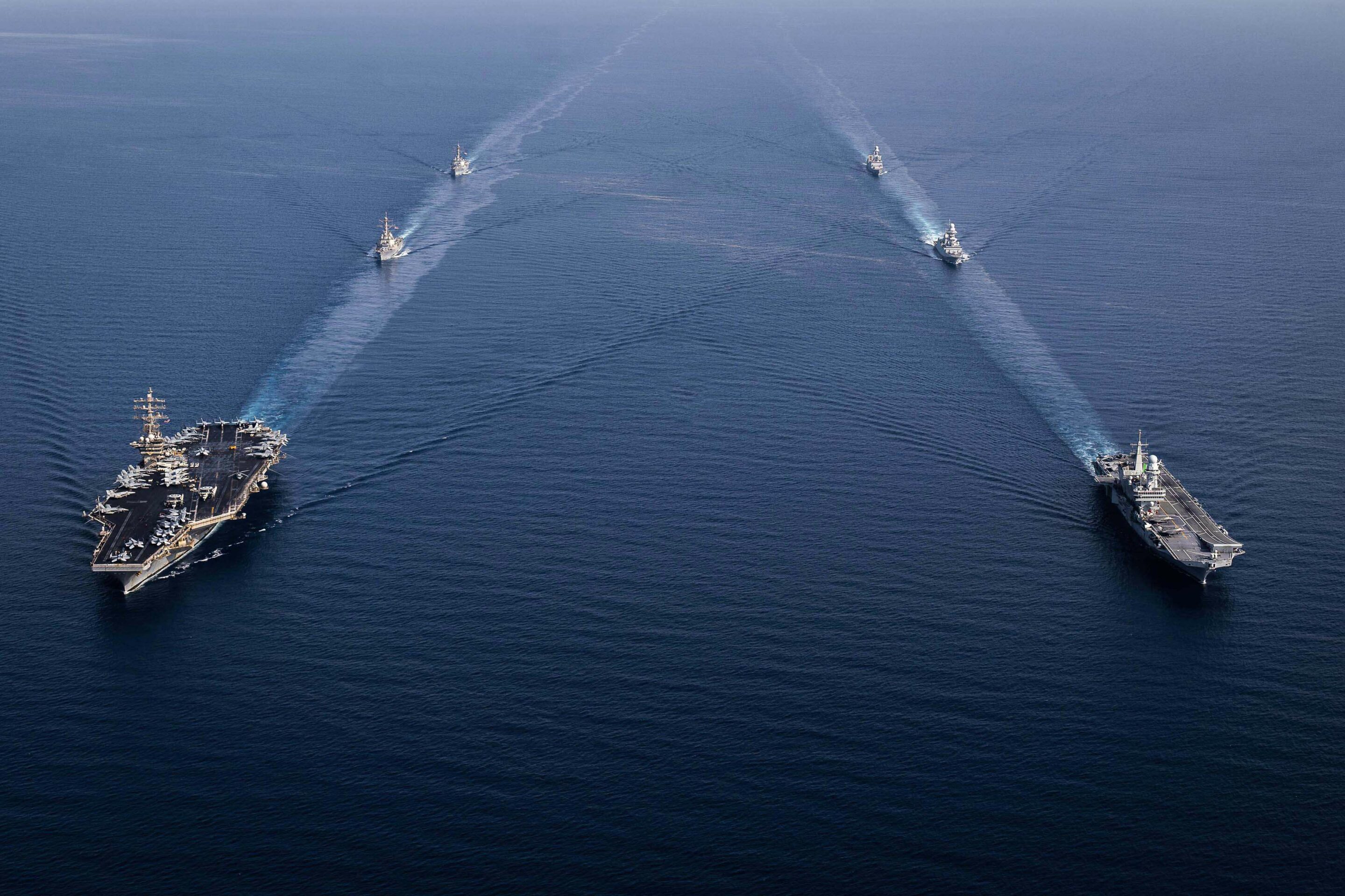 The Dwight D. Eisenhower Carrier Group steams in formation with the Italian aircraft carrier ITS Cavour (CVH 550) group//Photo by Italian Navy/ZUMA Press Wire/Shutterstock (14546401a)